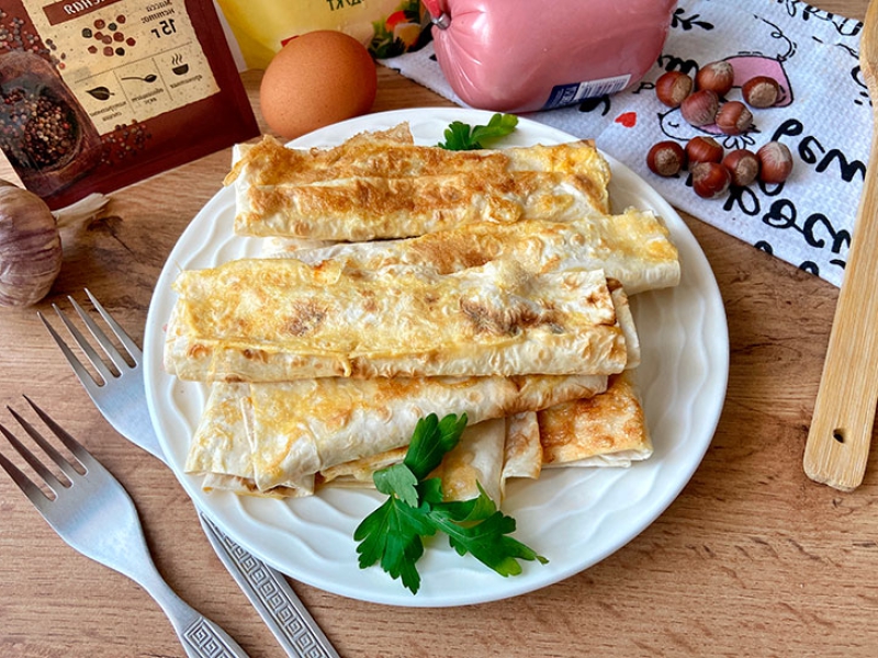 Трубочки з сиром та ковбасою: рецепт з фото покроково 9d265c841bfeddad92eb6d246d6ed9f0 Трубочки з сиром та ковбасою: рецепт з фото покроково